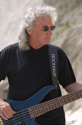 Terry Uttley playing bass guitar